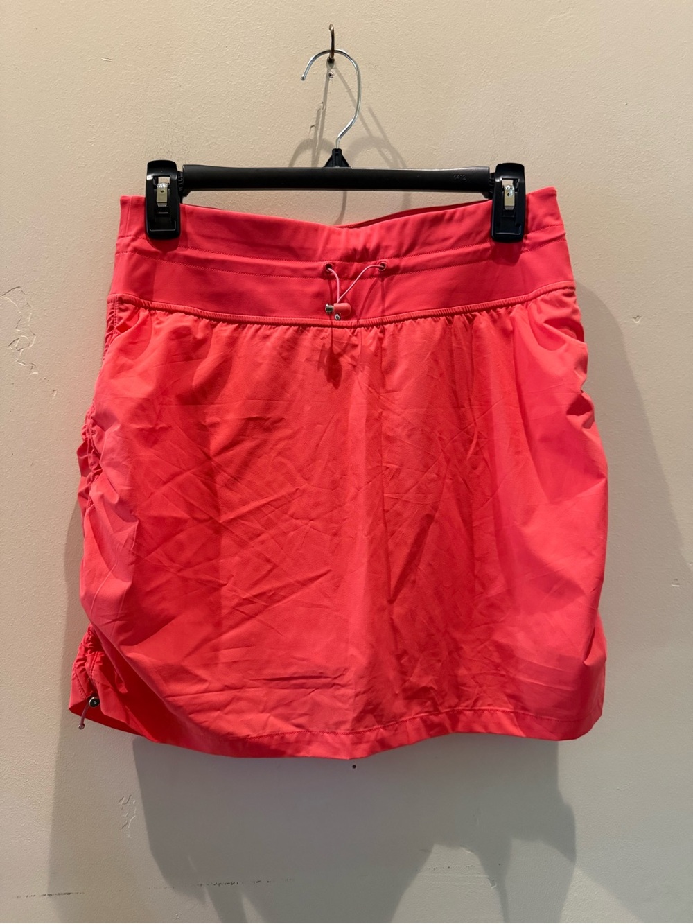 TravisMathew Bright Coral Performance Skort with hidden pockets